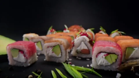Various sushi rolls. On a dark background. Stock Footage 300465719