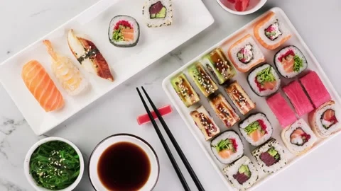 Various sushi rolls on a white stone background, top view, rotation. Top view of Stock Footage 149055254