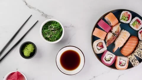 Various sushi rolls on a white stone background, top view, rotation. Top view of Stock Footage 149055306
