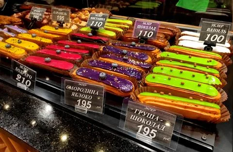 Various sweet eclairs presented on a display Stock-Fotos