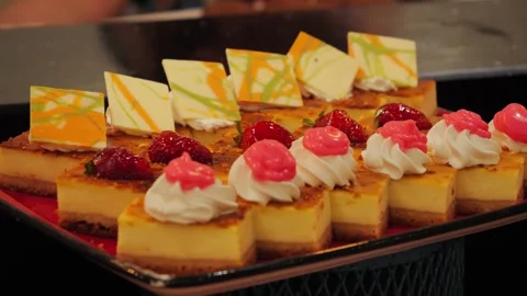 Various sweets, cakes on the table in the hotel buffet. Freshly baked desserts Stock Footage 320558749