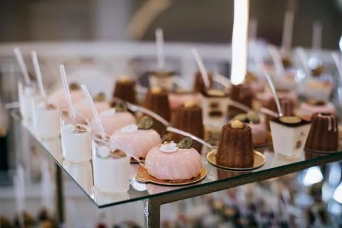 Various sweets on the table. Eclairs, cakes, candies Stock Photos