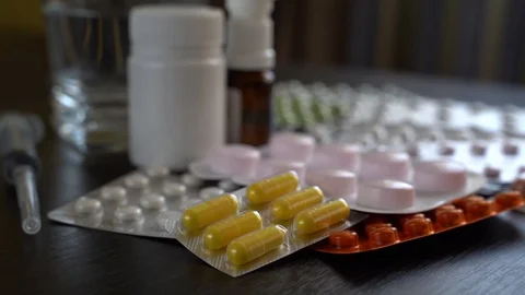 Various tablets, capsules and syringes. Stock Footage 128993171