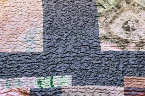 Various textured sewn pieces of patchwork cloth Stock Photos