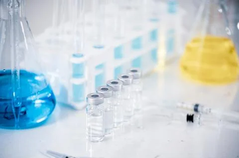 Various tools and containers used in experiments. Vaccine development concept. Stock Photos