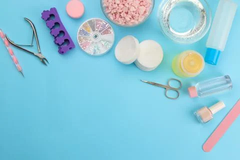 Various tools and things for manicure and pedicure on a blue background. vi.. Foto stock