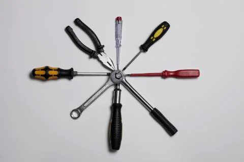 Various tools arranged in a circle, connected at the center Stock Photos
