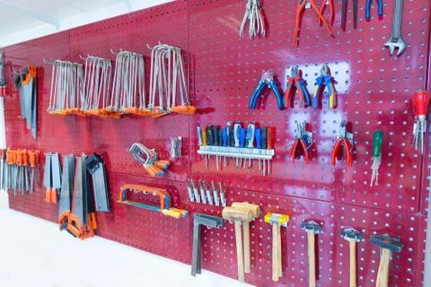 Various tools hanging at wall in high school Stock Photos
