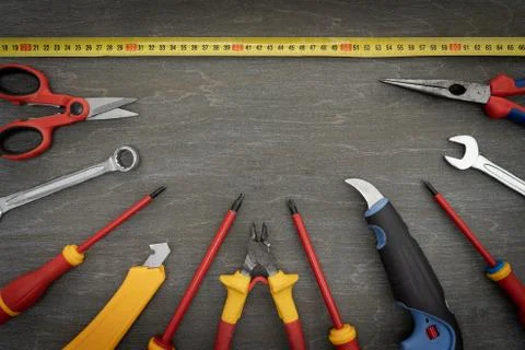 Various tools for repair, a tool kit for the home, on a vintage wooden backgr Stock Photos