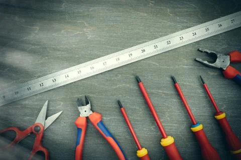 Various tools for repair, a tool kit for the home, on a vintage wooden backgr 스톡 사진