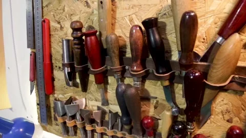 Various tools on the wall in leather craft workshop Stock-Footage 154361058