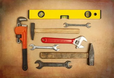 Various tools to work with, hammer, spanner, gas wrench, level to measure the Stock Photos