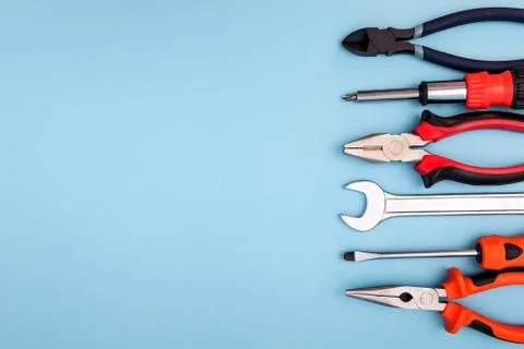 Various tools worker, hammer, wrench, screwdriver, pliers on blue background, Stock Photos