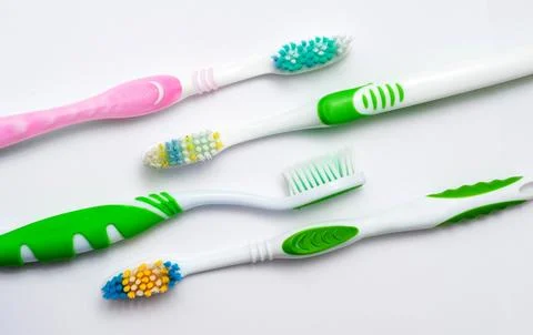 Various toothbrushes on a white background.. Stock Photos