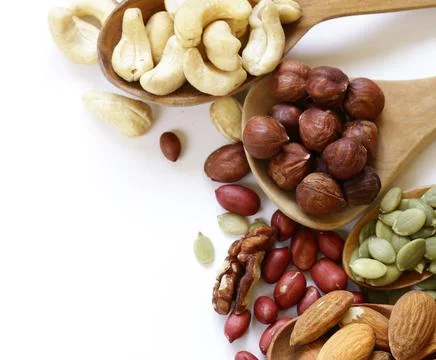 Various types of assorted nuts for healthy eating Stock Photos