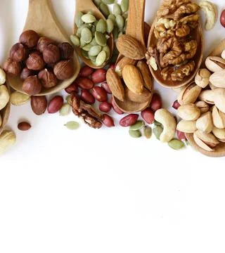 Various types of assorted nuts for healthy eating Stock Photos