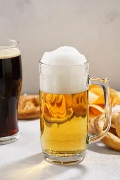 Various types of beer - light and dark and snack variety. Stock Photos