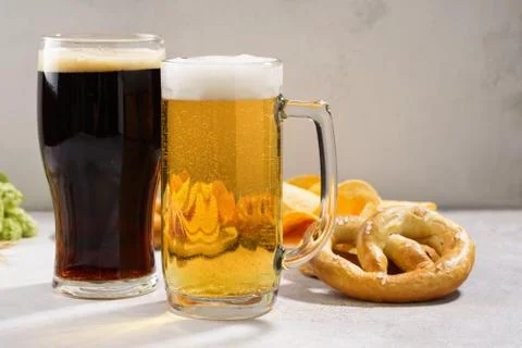 Various types of beer - light and dark and snack variety. Stock Photos