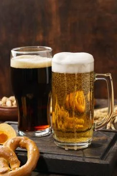 Various types of beer - light and dark and snack variety. Stock Photos