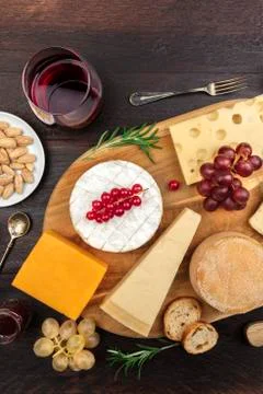 Various types of cheese on rustic background with copyspace Stock Photos