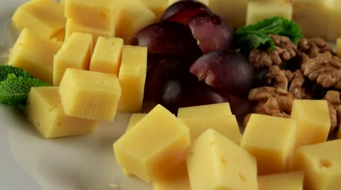 Various types of cheese in the white plate, loop Stock Footage 61708083