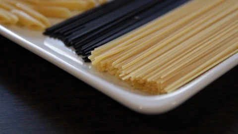 Various types of dry pasta.close-up.macro.the camera flies over this ahead Stock Footage 121445664