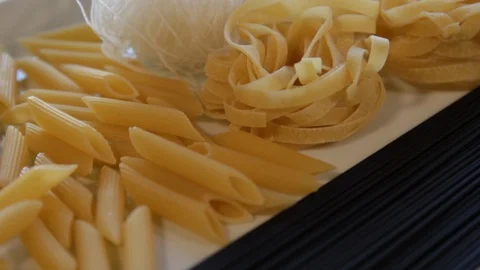 Various types of dry pasta.close-up.macro.the camera flies over it backwards Stock Footage 121518554