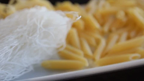 Various types of dry pasta.funchoz.close-up.macro.the camera moves around this Stock Footage 122410632