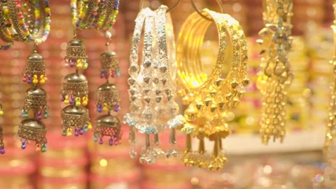 Various types of ear rings hanging in the market Video stock 221737796