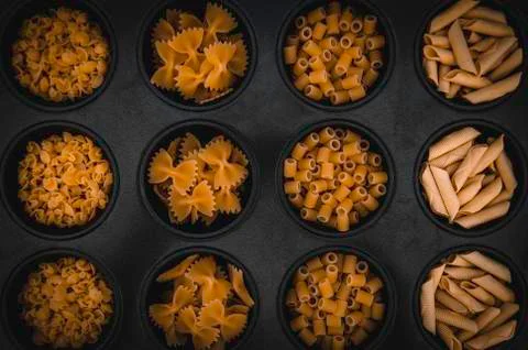 Various types of italian pasta. Cooking concept. Top view Stock Photos