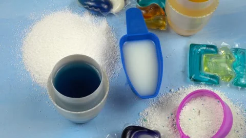 Various types of the laundry detergents on a blue background  Stock Footage 301121678