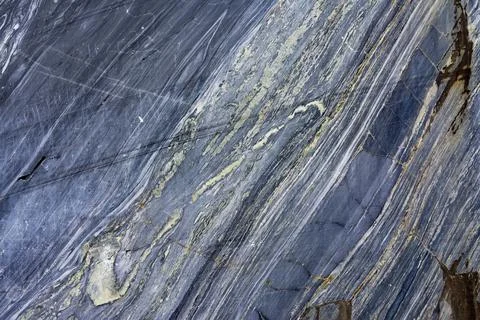 Various types of marble in an abandoned quarry in Ruskeala. Stock Photos