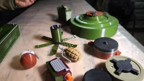 Various types of mines, grenades and explosives on the table. Stock Footage 317749569