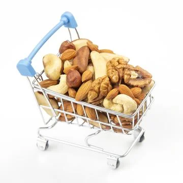 Various types of nuts in the grocery cart. Marketing sale of food products. V Stock Photos
