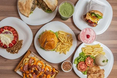 Various types of plates containing different food Stock Photos
