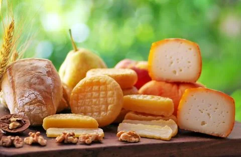 Various types of portuguese cheese on table Stock Photos