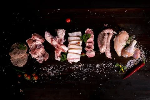 Various types of raw meat of beef, pork, chicken on a stone background Stock Photos