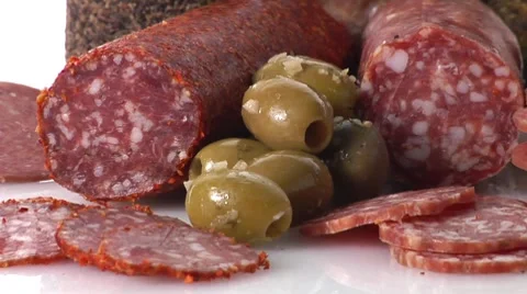 Various types of salami and green olives Stock Footage 8574715