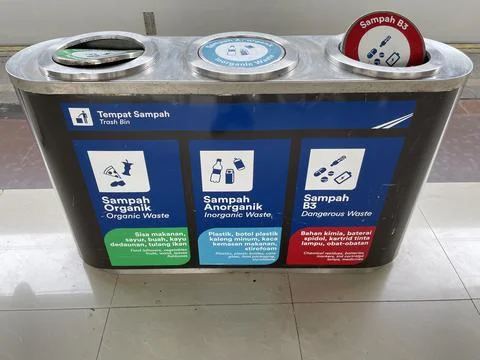 Various types of separate, multi-colored trash cans on the station platforms Stock Photos