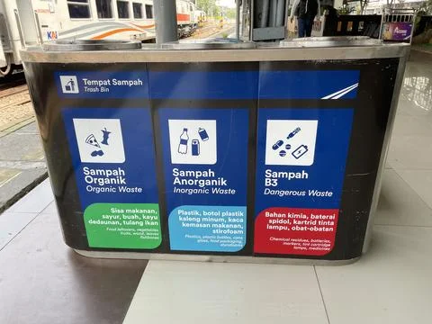 Various types of separate, multi-colored trash cans on the station platforms Stock Photos