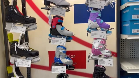Various types of skates on display on a shelf Stock-Footage 256282527