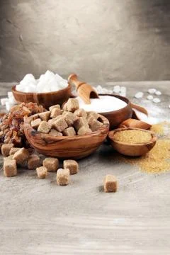 Various types of sugar, brown sugar and white on table Stock Photos