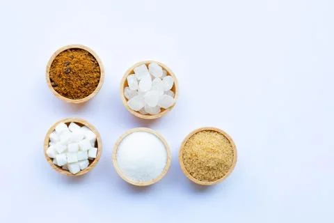 Various types of sugar on white. Stock Photos