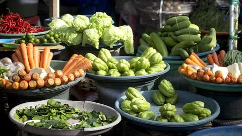 Various types of vegetables such as carrots, cabbage and others are being sold Stock Photos