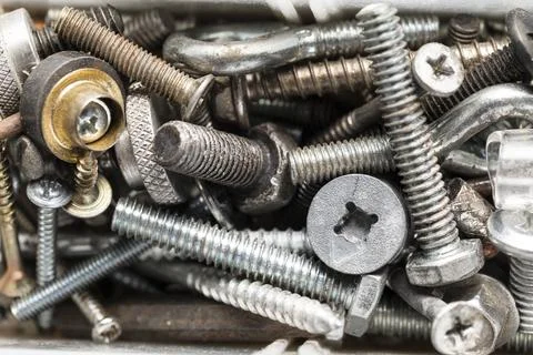 Various types of worn screws, top view Stock Photos