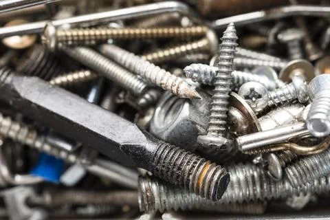 Various types of worn screws, top view Stock Photos