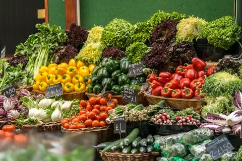 Various vegetables and salads in baskets for sale at market Stock Photos