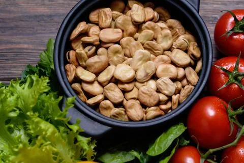Various vegetables background. vicia faba beans, tomatoes. Stock Photos