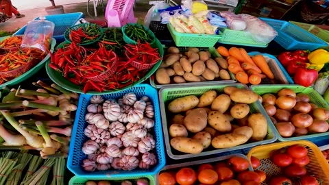 Various vegetables in baskets on the counter, farm vegetables for sale Video stock 171557124