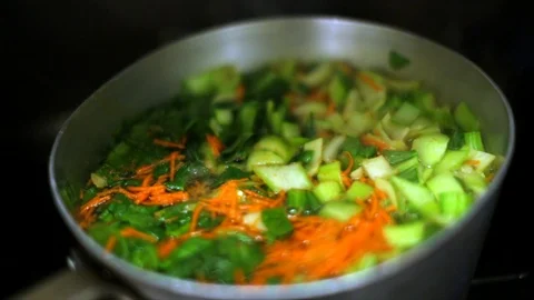 Various vegetables cooking in a pan. Stock Footage 88405332